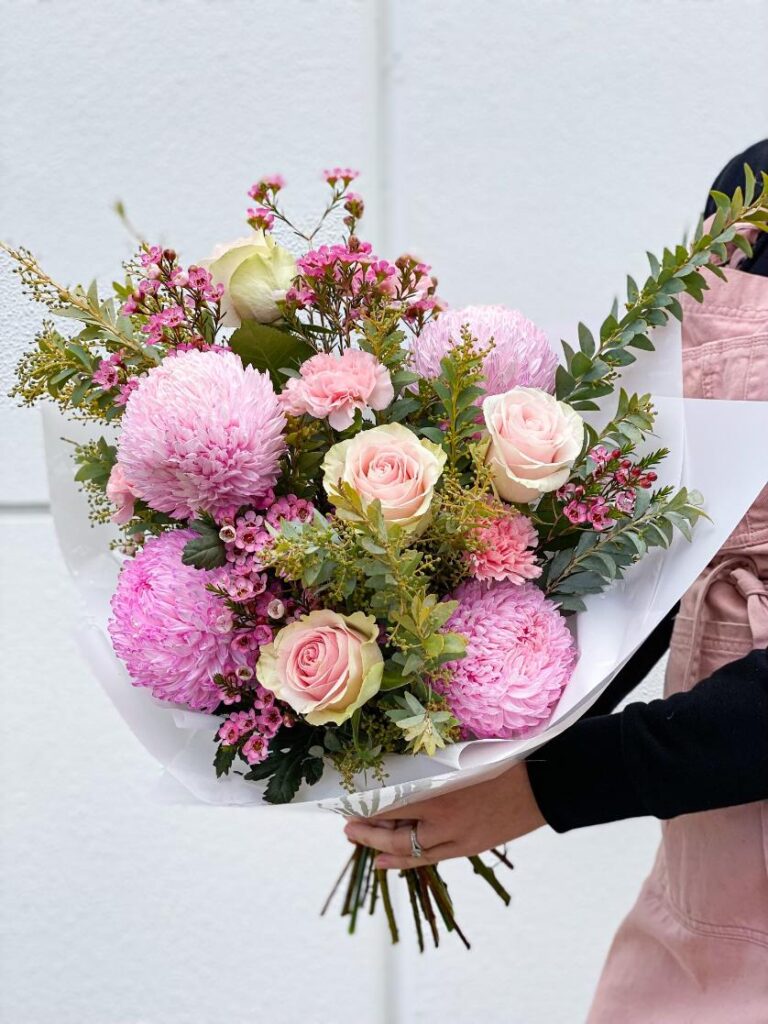 Woman Holding Flowers | Featured Image for the Melbourne Flower Delivery Home Page of Poco Posy Melbourne.